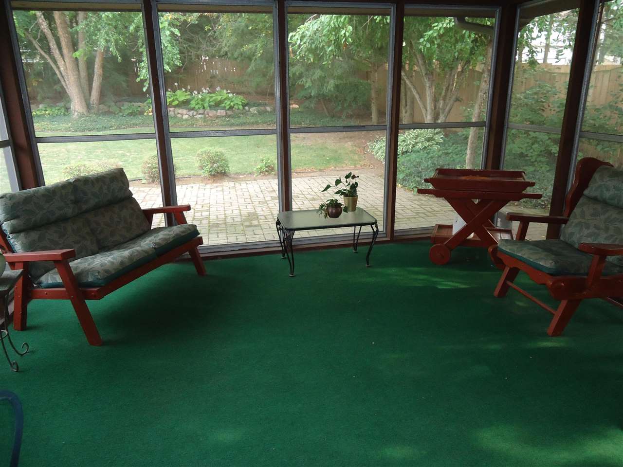 5224 Brookview Road Rockford, IL 61107 - Photo 14 of 22 a living room with furniture and a floor to ceiling window