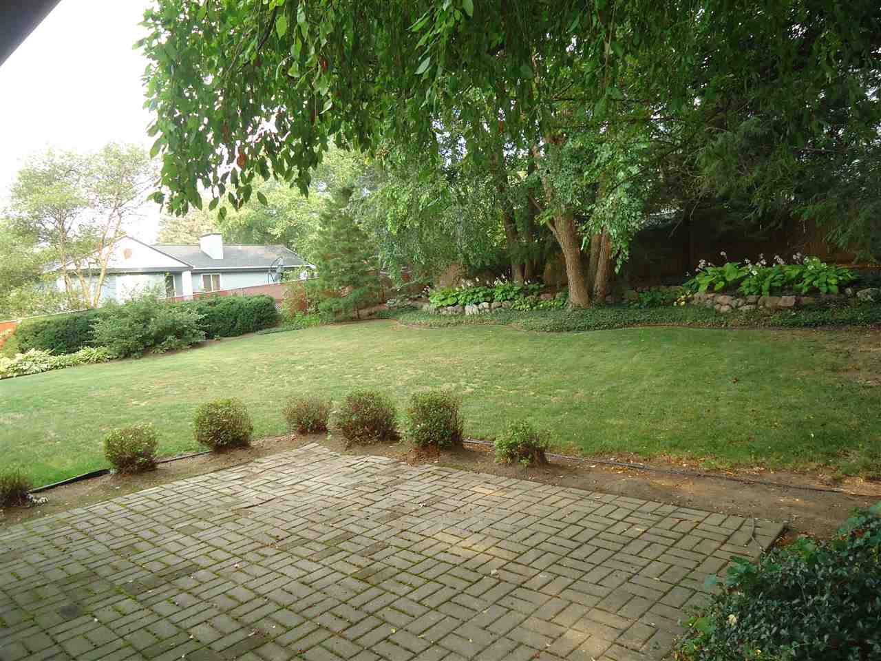 5224 Brookview Road Rockford, IL 61107 - Photo 16 of 22 a backyard of a house with lots of green space