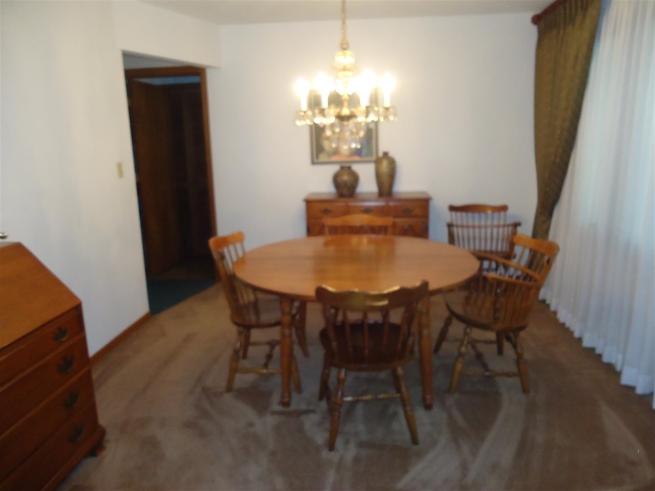 5224 Brookview Road Rockford, IL 61107 - Photo 5 of 22 a view of a dining room with furniture and chandelier