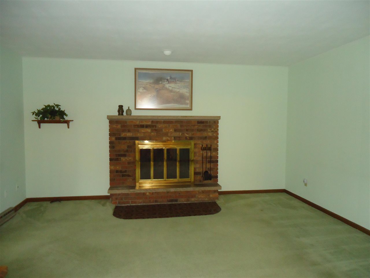 5224 Brookview Road Rockford, IL 61107 - Photo 6 of 22 a living room with a fireplace