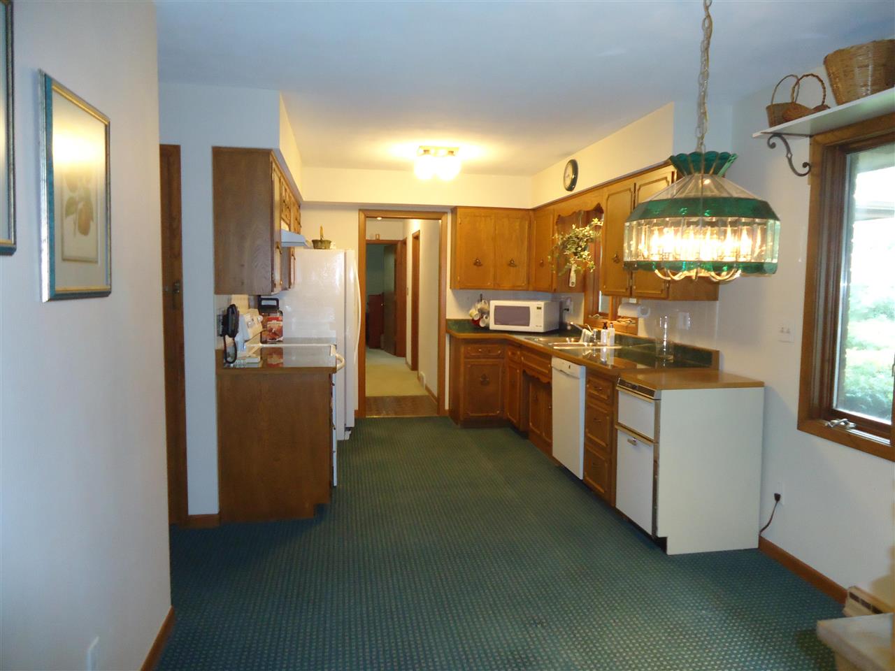 5224 Brookview Road Rockford, IL 61107 - Photo 7 of 22 a kitchen with cabinets and refrigerator