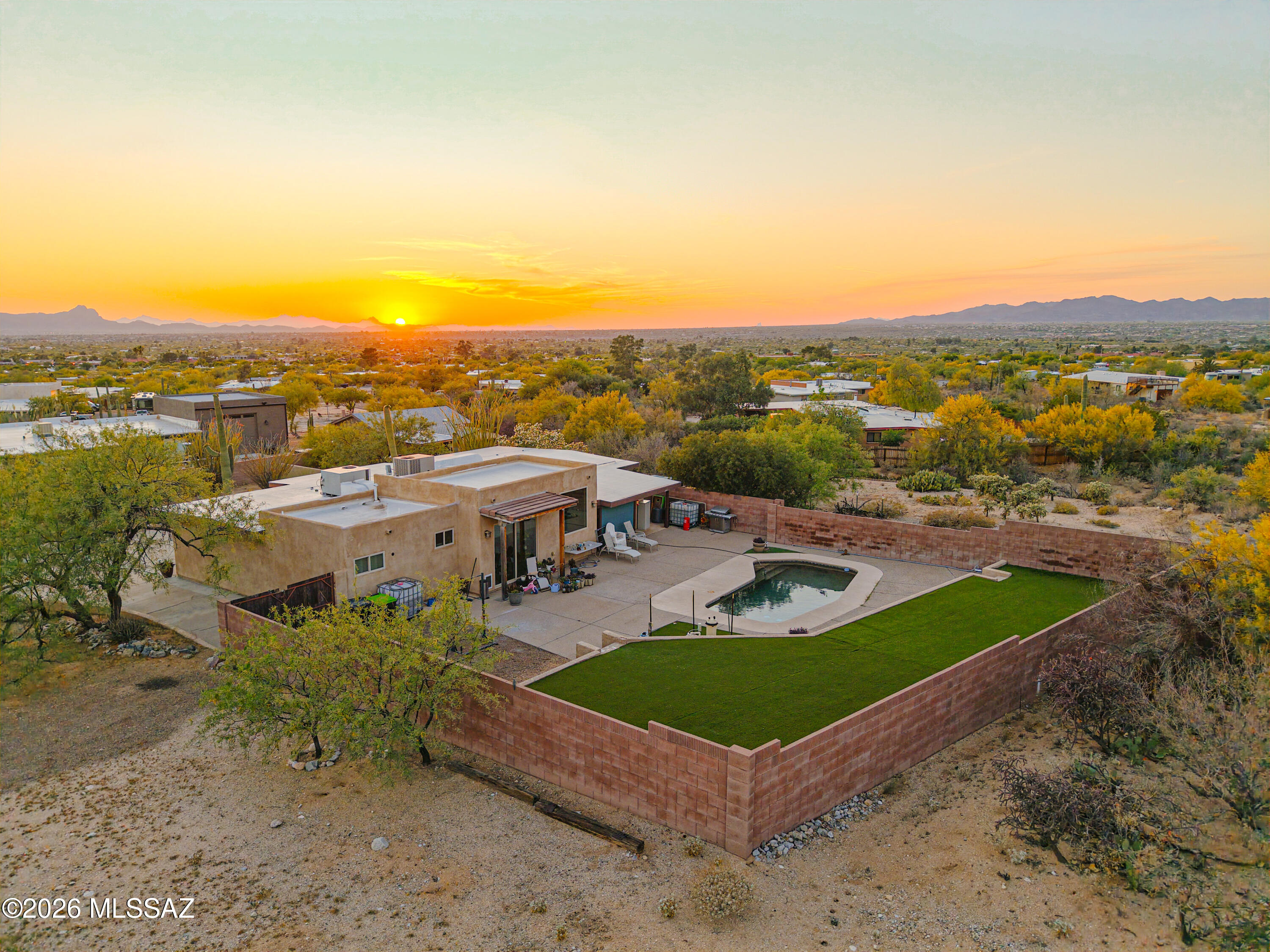 545 East Rancho Catalina Place Tucson, AZ 85704 - Photo 2 of 13 an aerial view of a house with a garden and lake view