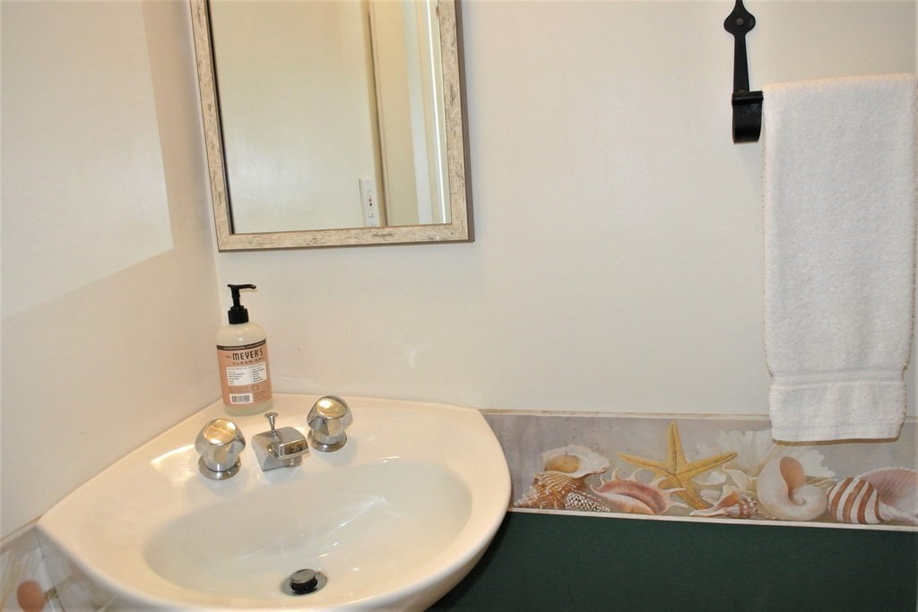 16 Brant Rock Road Mashpee, MA 02649 - Photo 11 of 22 a bathroom with a sink and a mirror