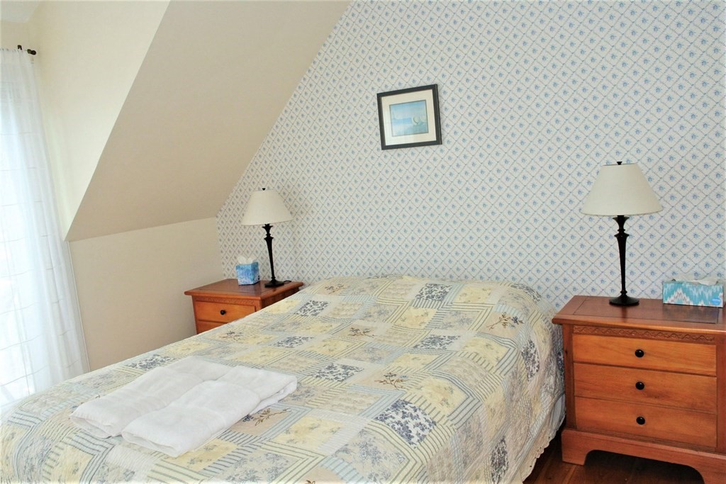 16 Brant Rock Road Mashpee, MA 02649 - Photo 12 of 22 a bedroom with a bed and a dresser