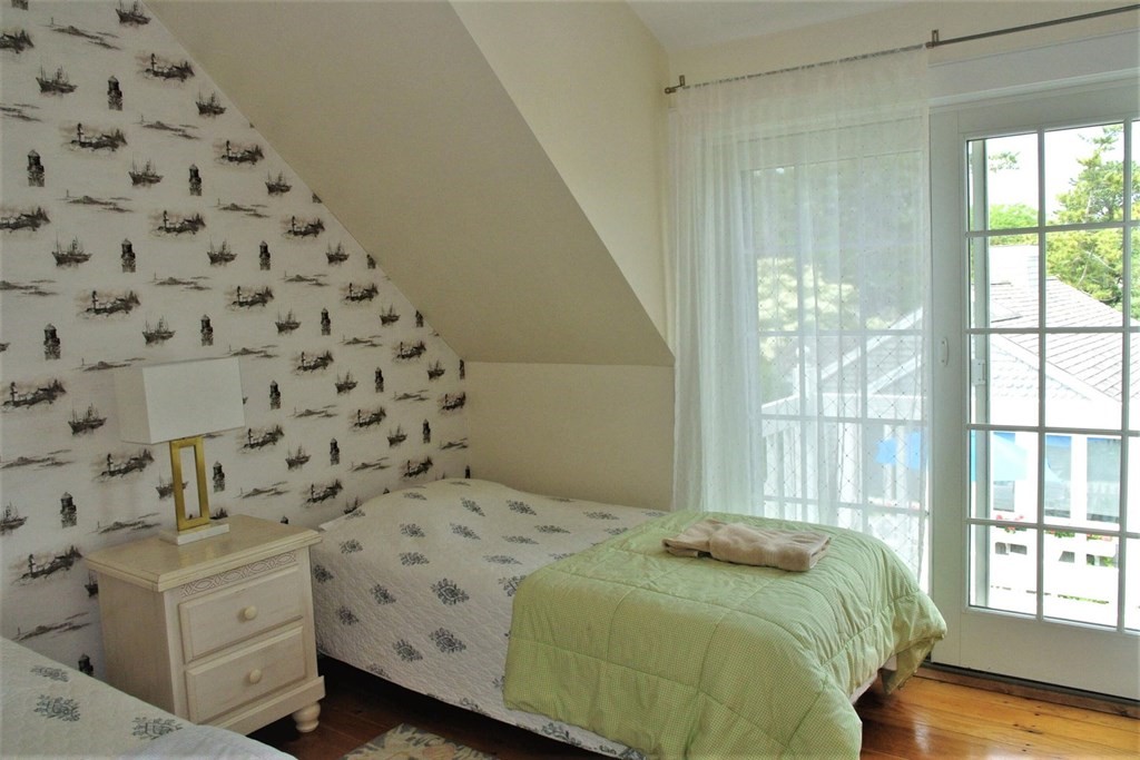 16 Brant Rock Road Mashpee, MA 02649 - Photo 15 of 22 a bedroom with a bed and a window