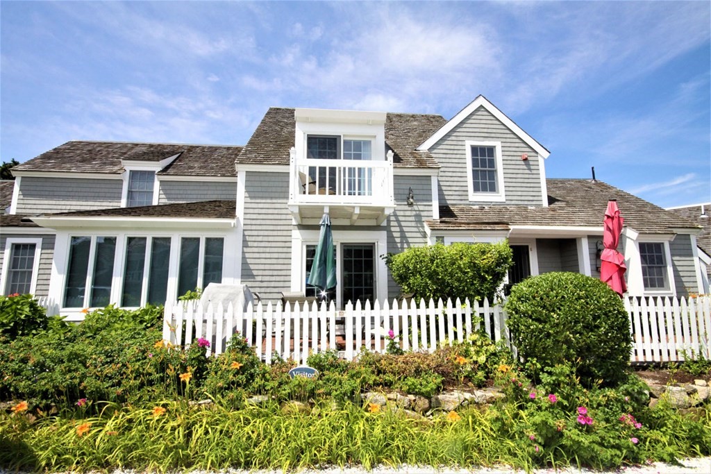 16 Brant Rock Road Mashpee, MA 02649 - Photo 17 of 22 a front view of a house with a garden