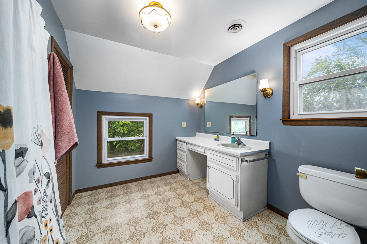 1718 Highway 23 Marengo, IL 60152 - Photo 4 of 5 a living room with a stove and a window