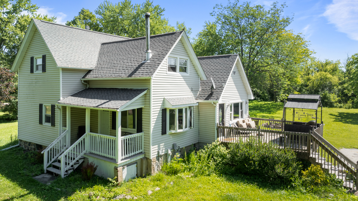 1718 Highway 23 Marengo, IL 60152 - Photo 2 of 5 an aerial view of a house with a yard