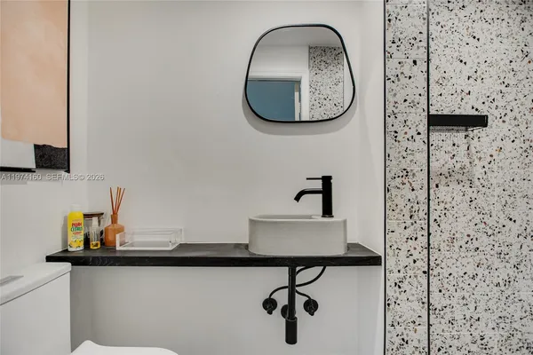 a bathroom with a sink and a mirror