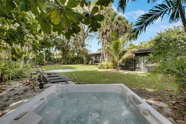 a view of backyard with outdoor space