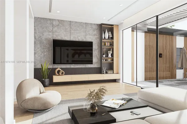 a living room with a large window and furniture