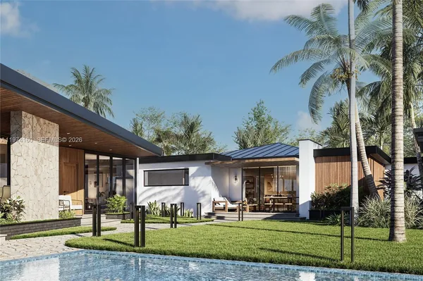 a view of a house with backyard sitting area and garden