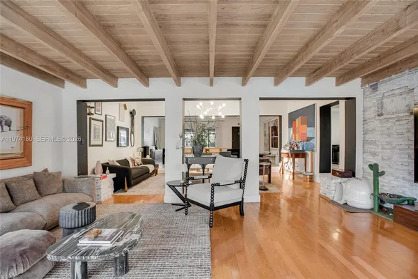 a living room with fireplace furniture and a wooden floor