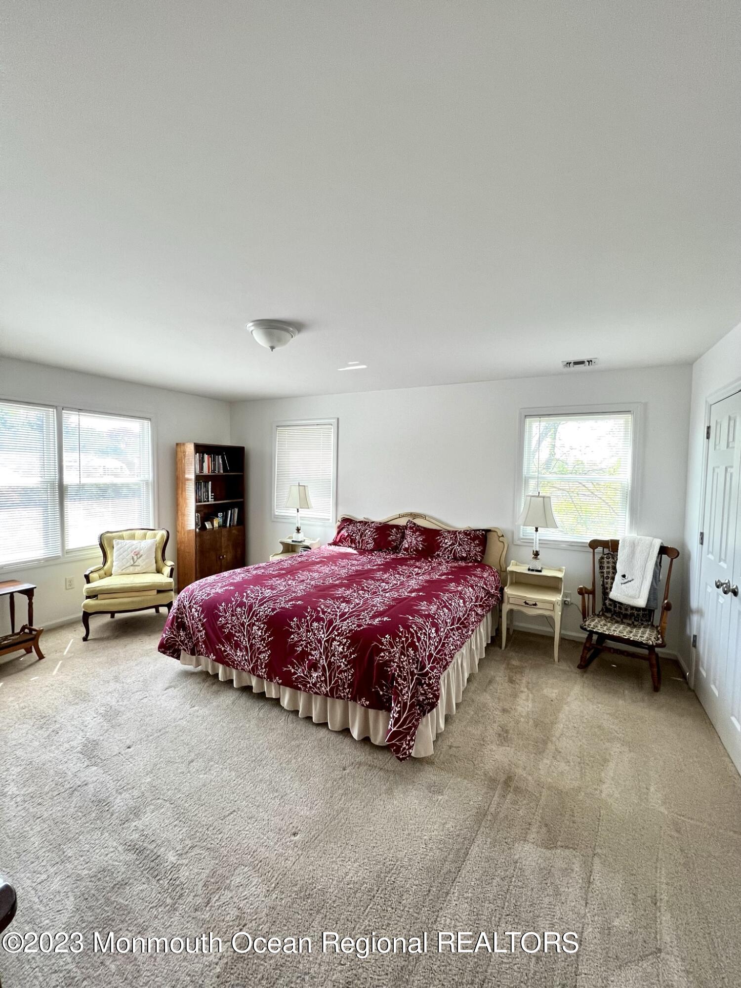 13 Appleton Avenue Leonardo, NJ 07737 - Photo 11 of 19 a spacious bedroom with a bed and large windows