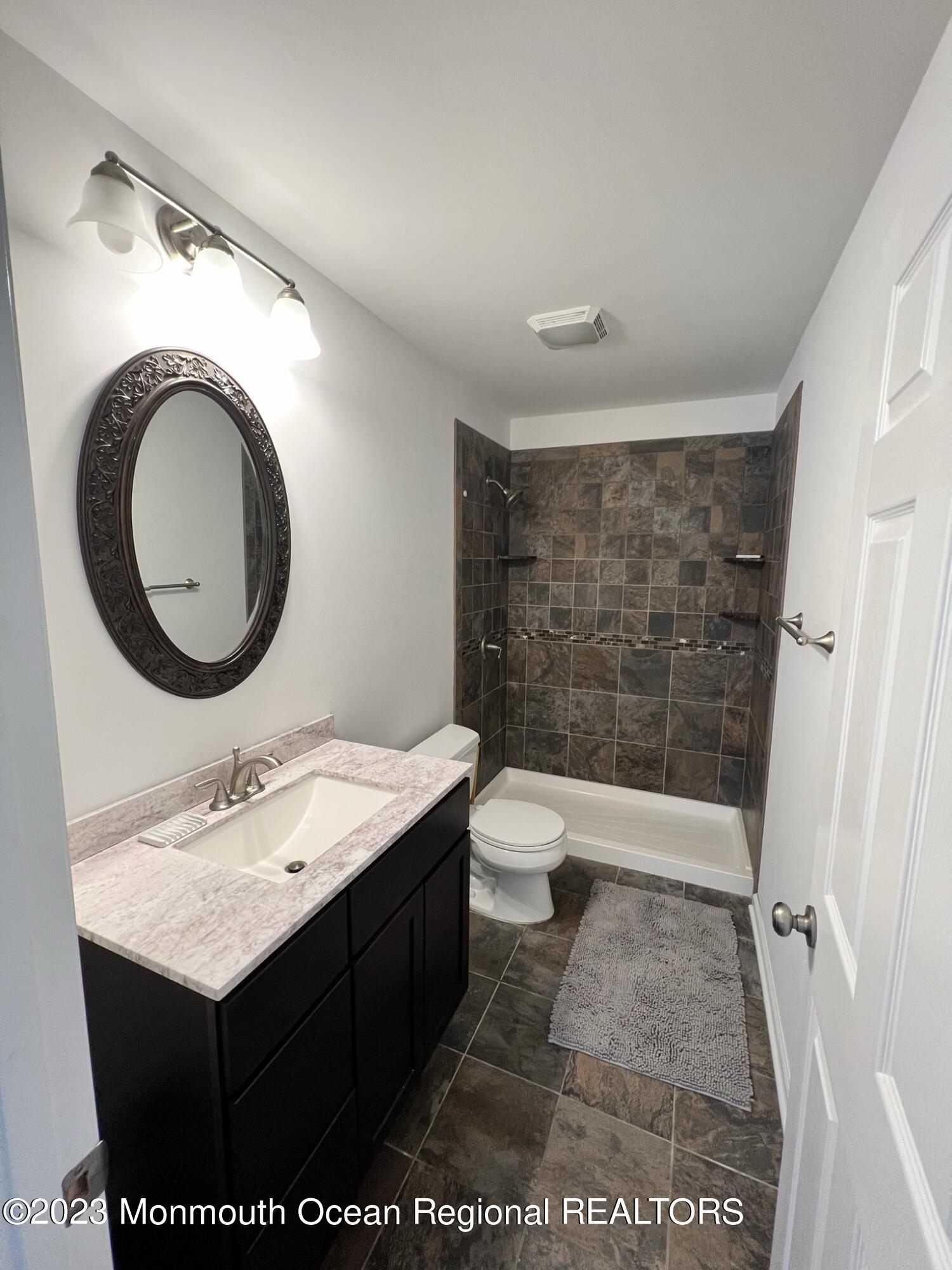 13 Appleton Avenue Leonardo, NJ 07737 - Photo 15 of 19 a bathroom with a sink and a mirror