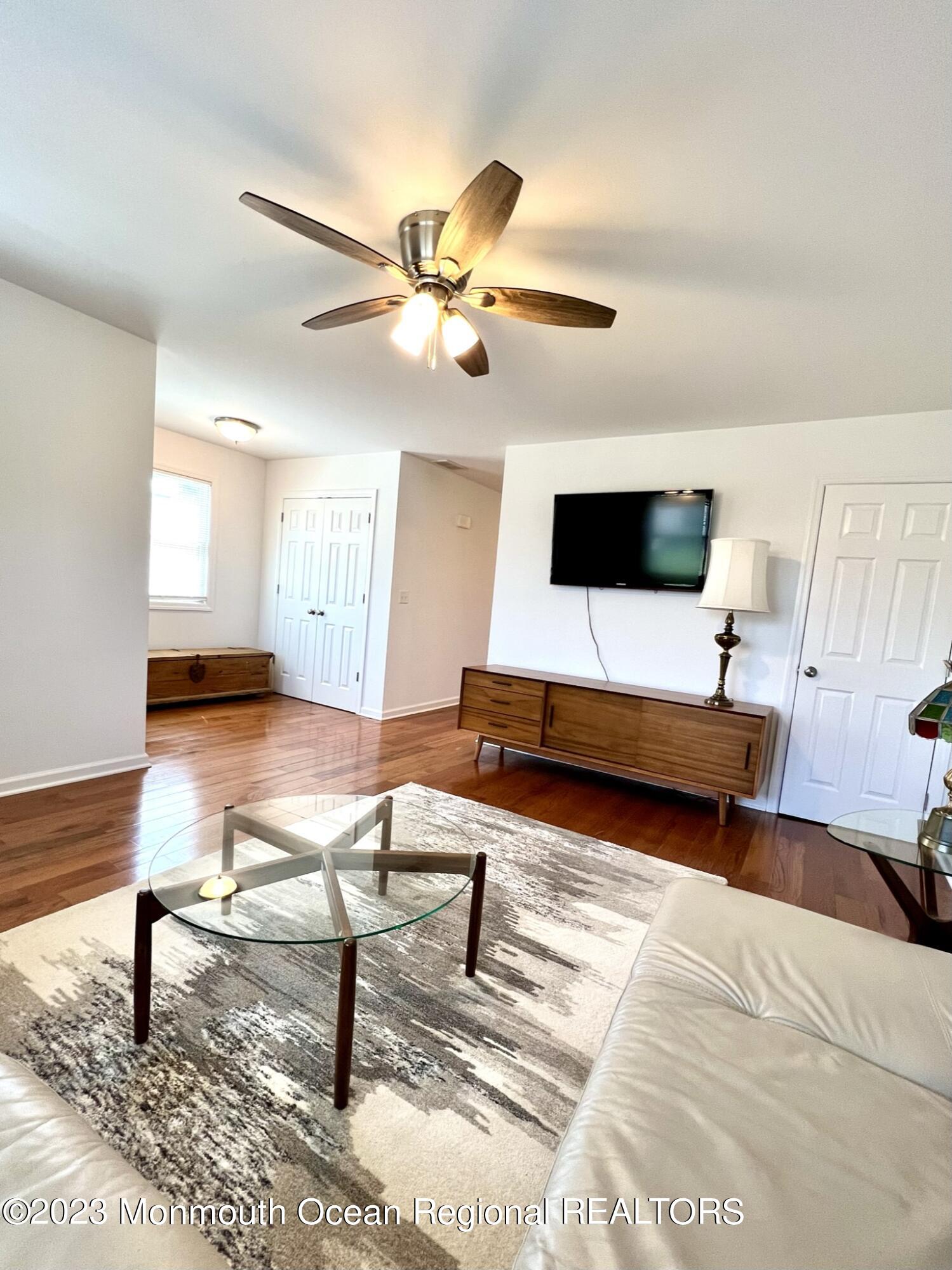 13 Appleton Avenue Leonardo, NJ 07737 - Photo 3 of 19 a living room with furniture and a flat screen tv