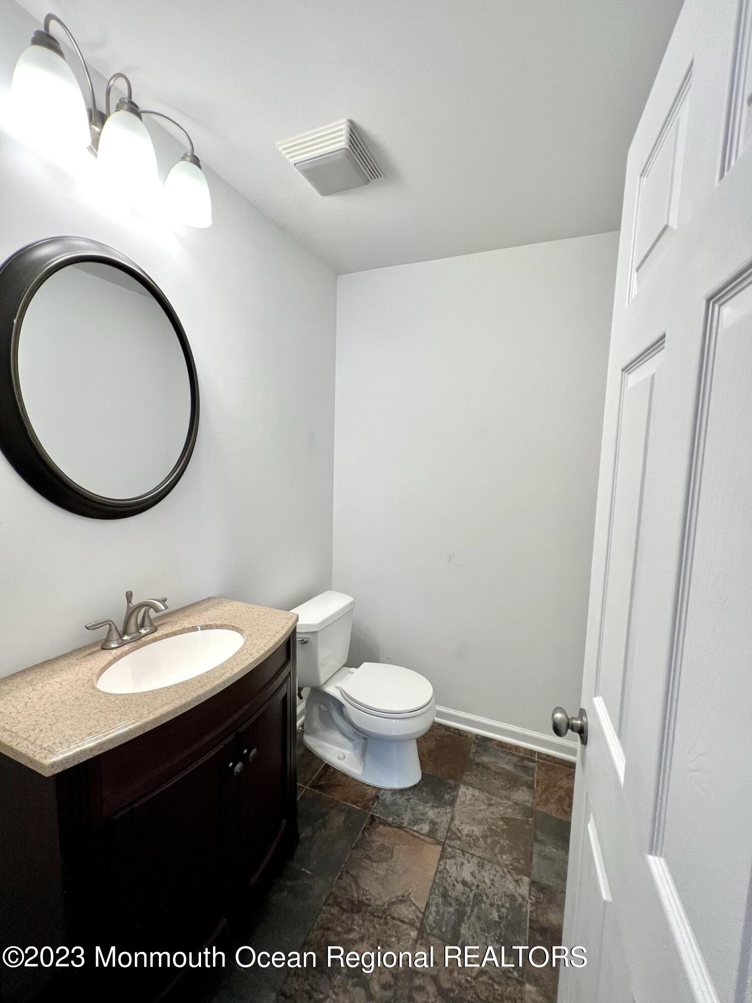 13 Appleton Avenue Leonardo, NJ 07737 - Photo 5 of 19 a bathroom with a sink a toilet and a mirror