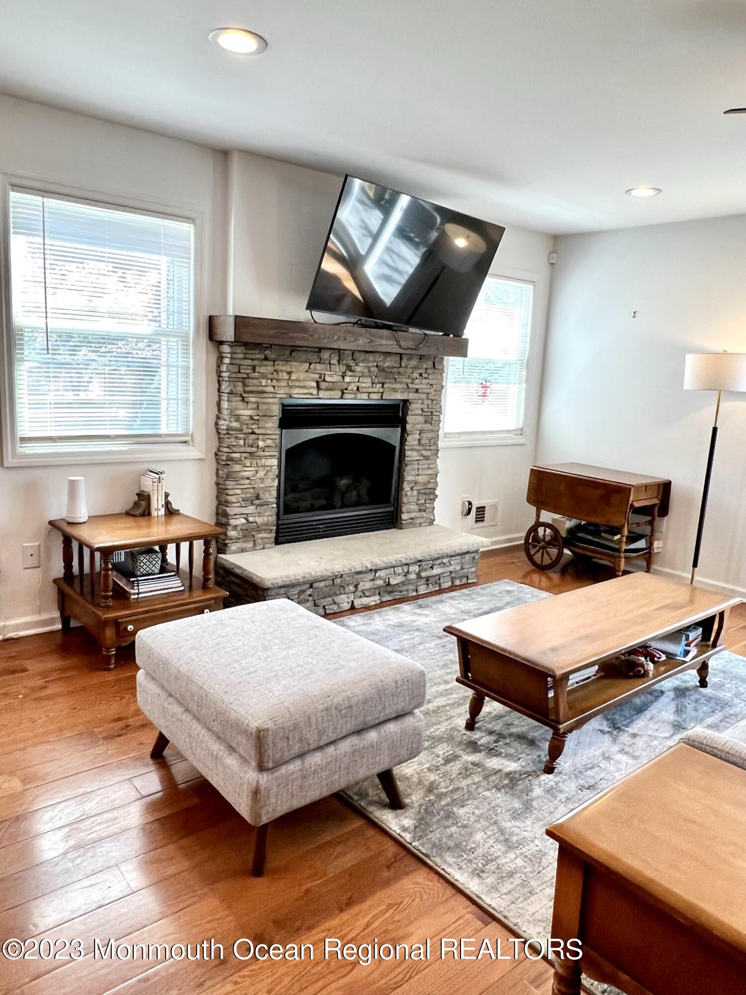 13 Appleton Avenue Leonardo, NJ 07737 - Photo 8 of 19 a living room with furniture and a fireplace