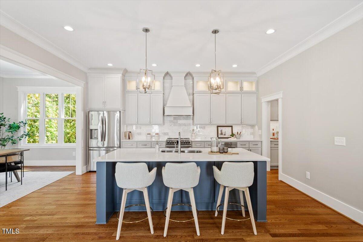 3932 Old Chapel Hill Road Durham, NC 27707 - Photo 4 of 46 a dining table seating space and a chandelier
