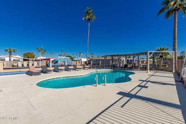 a view of a swimming pool with a patio