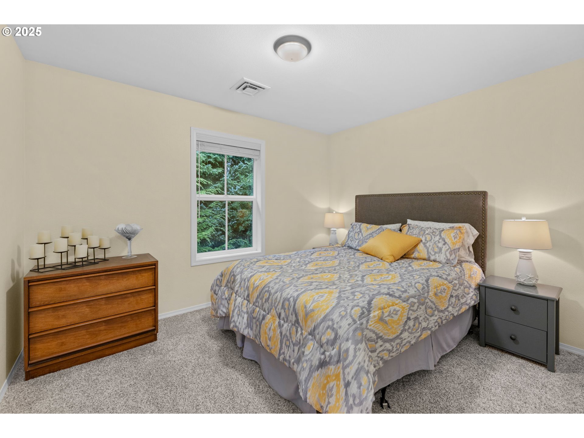 420 Elk Creek Road, Unit 503 Cannon Beach, OR 97110 - Photo 15 of 25 a bedroom with a bed and a window