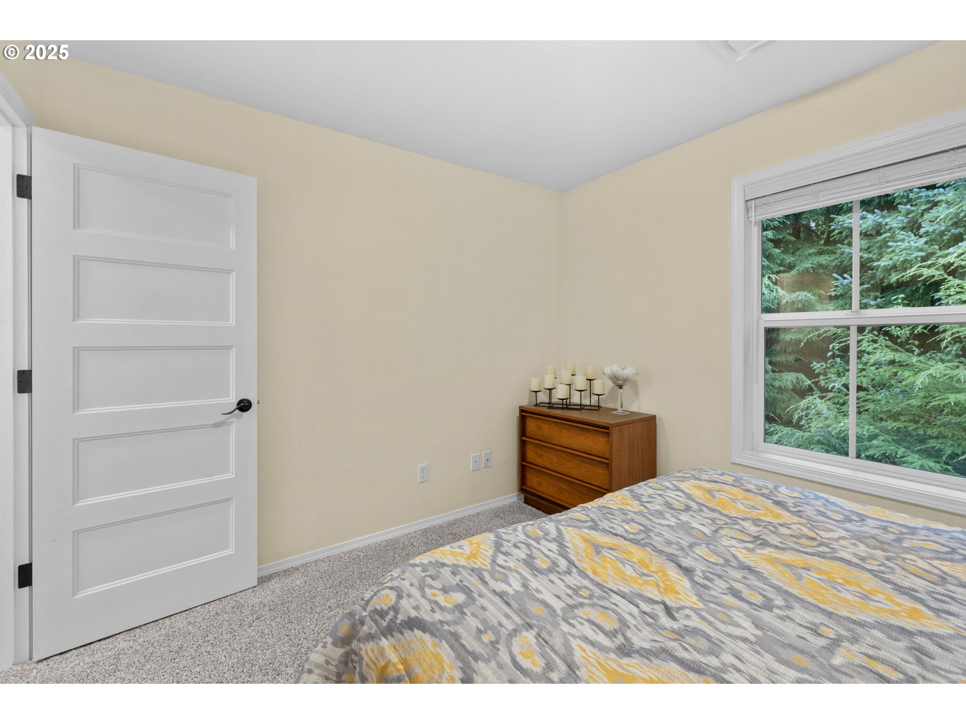 420 Elk Creek Road, Unit 503 Cannon Beach, OR 97110 - Photo 16 of 25 a bedroom with a bed and a window