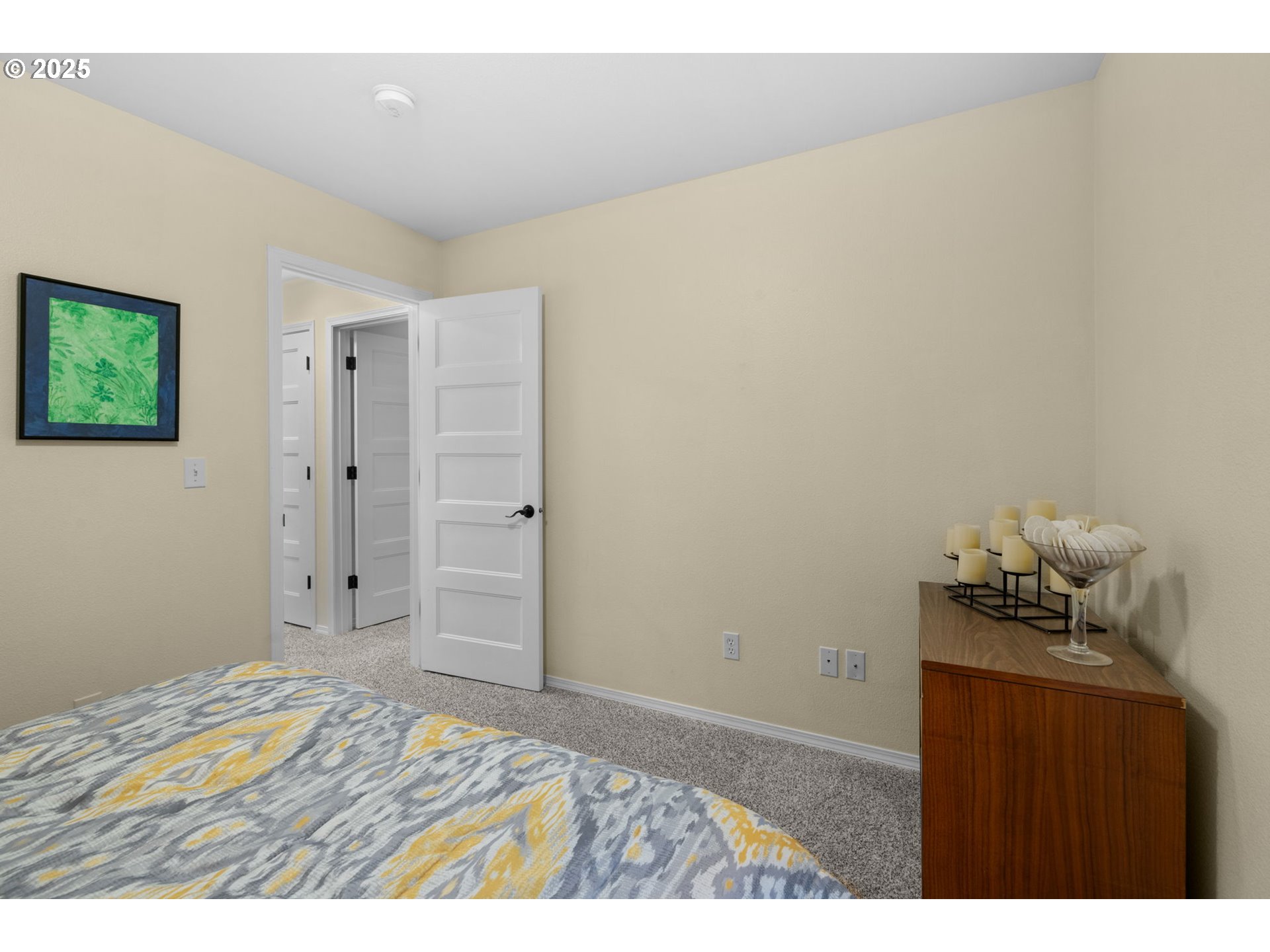 420 Elk Creek Road, Unit 503 Cannon Beach, OR 97110 - Photo 18 of 25 a bedroom with a bed and a lamp on the dresser