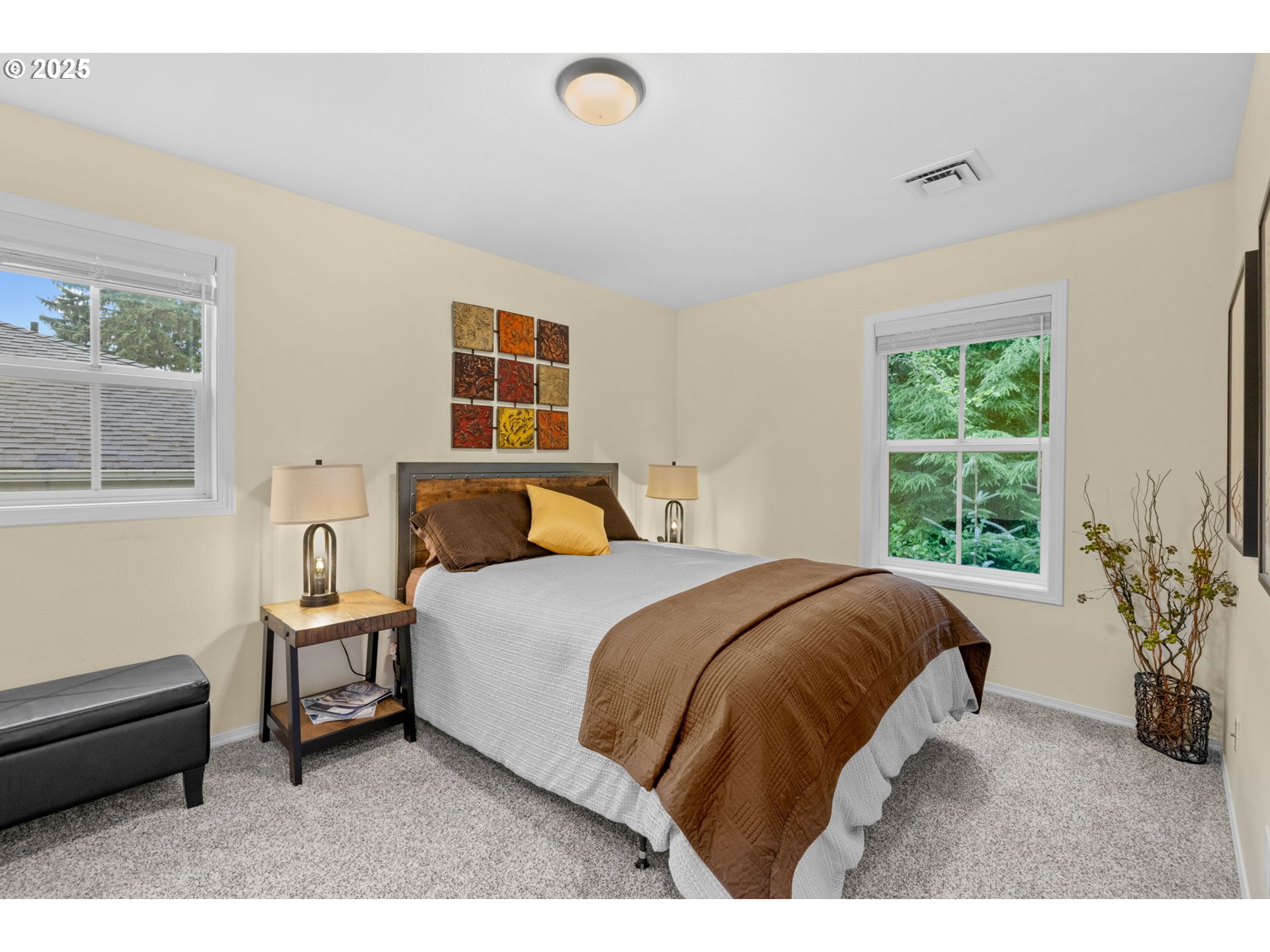 420 Elk Creek Road, Unit 503 Cannon Beach, OR 97110 - Photo 19 of 25 a bedroom with a bed window and potted plant on the dresser