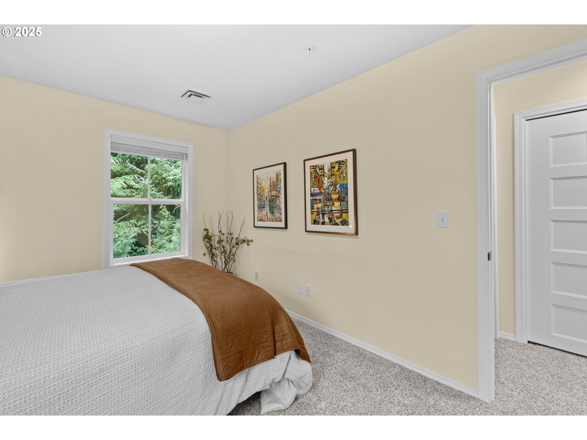 420 Elk Creek Road, Unit 503 Cannon Beach, OR 97110 - Photo 20 of 25 a bedroom with a bed and a window
