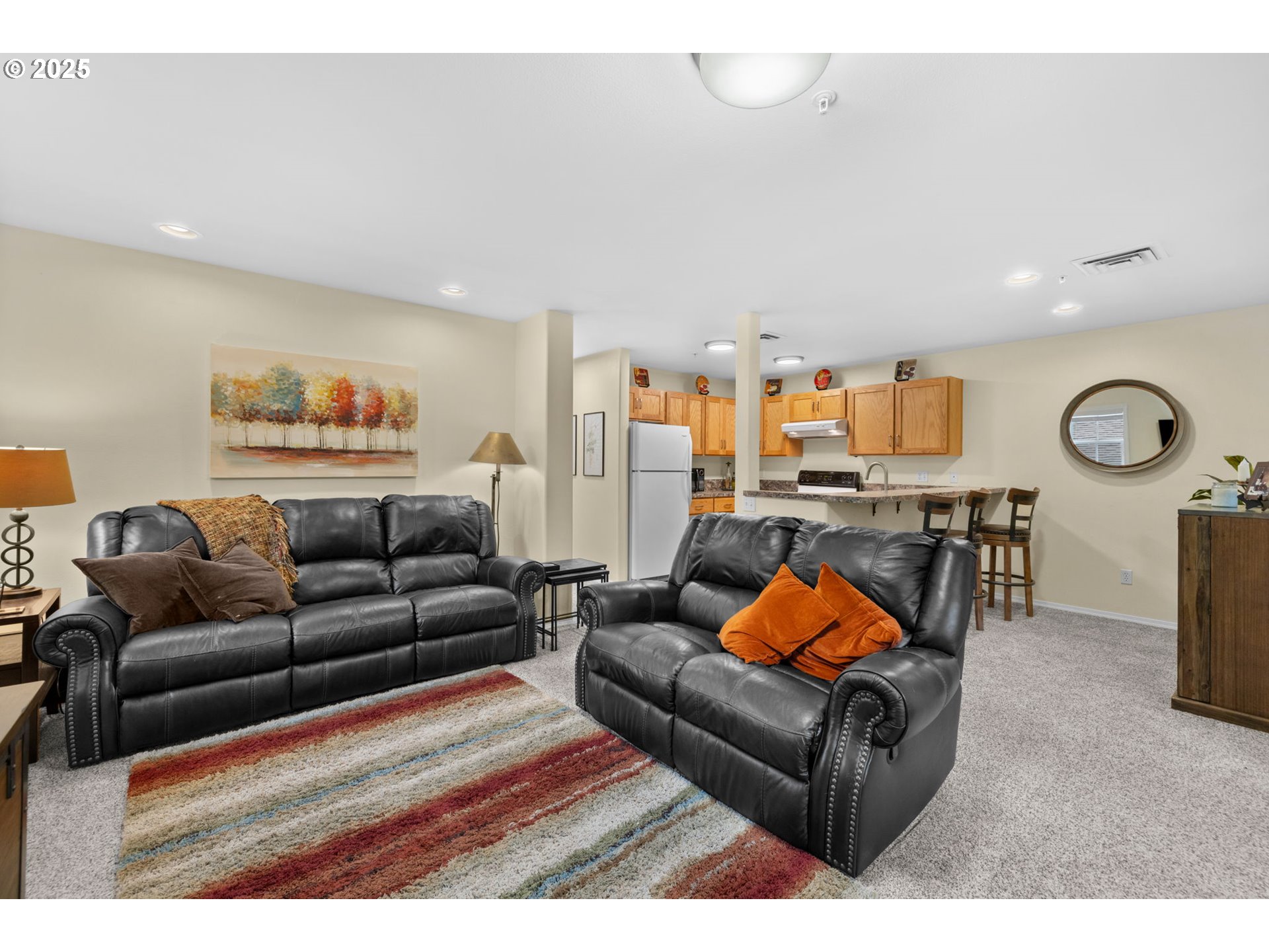 420 Elk Creek Road, Unit 503 Cannon Beach, OR 97110 - Photo 4 of 25 a living room with furniture a rug and a large window