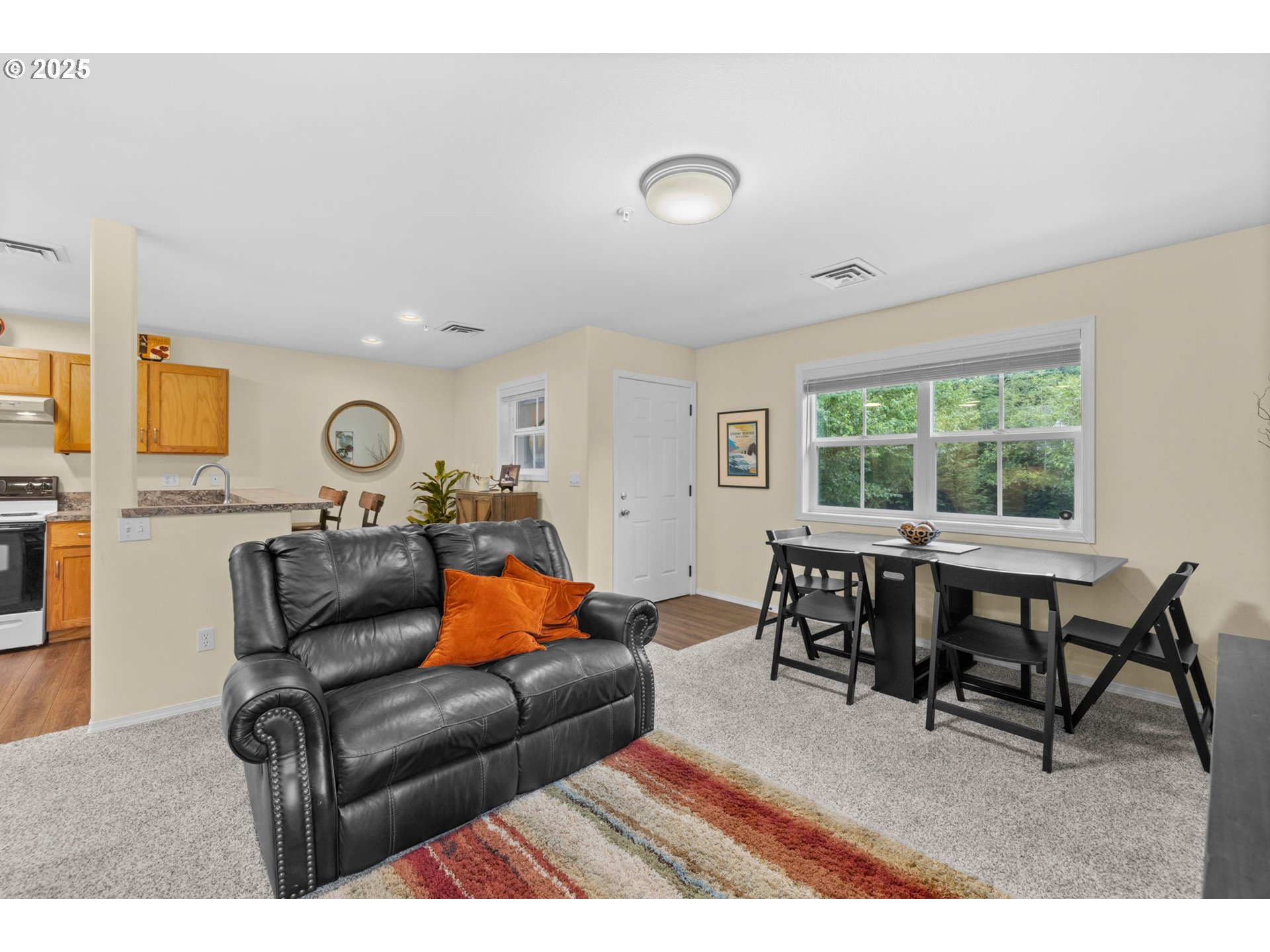 420 Elk Creek Road, Unit 503 Cannon Beach, OR 97110 - Photo 5 of 25 a living room with furniture and a window