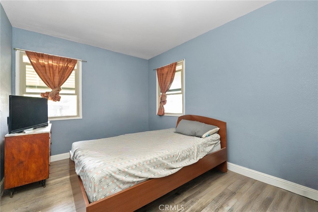 8925 Penny Drive Riverside, CA 92503 - Photo 18 of 48 a bedroom with a bed and a flat screen tv