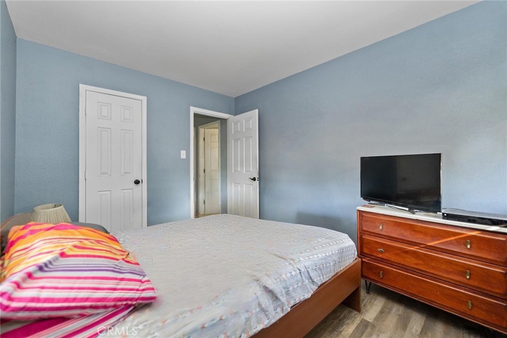 8925 Penny Drive Riverside, CA 92503 - Photo 19 of 48 a bedroom with a bed and a flat screen tv