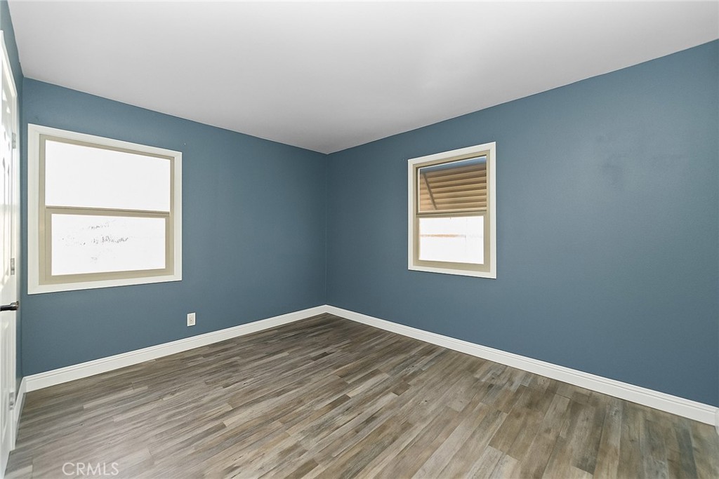8925 Penny Drive Riverside, CA 92503 - Photo 23 of 48 a view of an empty room with wooden floor and a window
