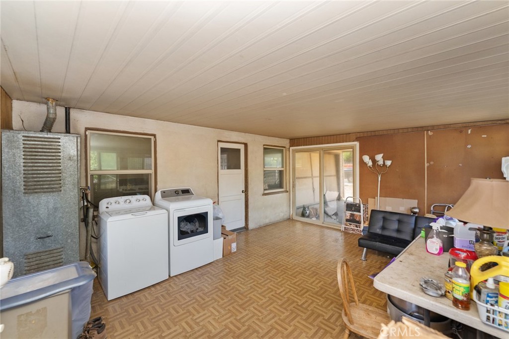 8925 Penny Drive Riverside, CA 92503 - Photo 31 of 48 a living room with furniture and a flat screen tv