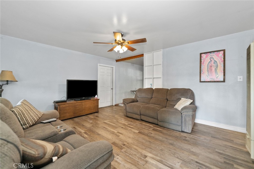 8925 Penny Drive Riverside, CA 92503 - Photo 4 of 48 a living room with furniture and a flat screen tv
