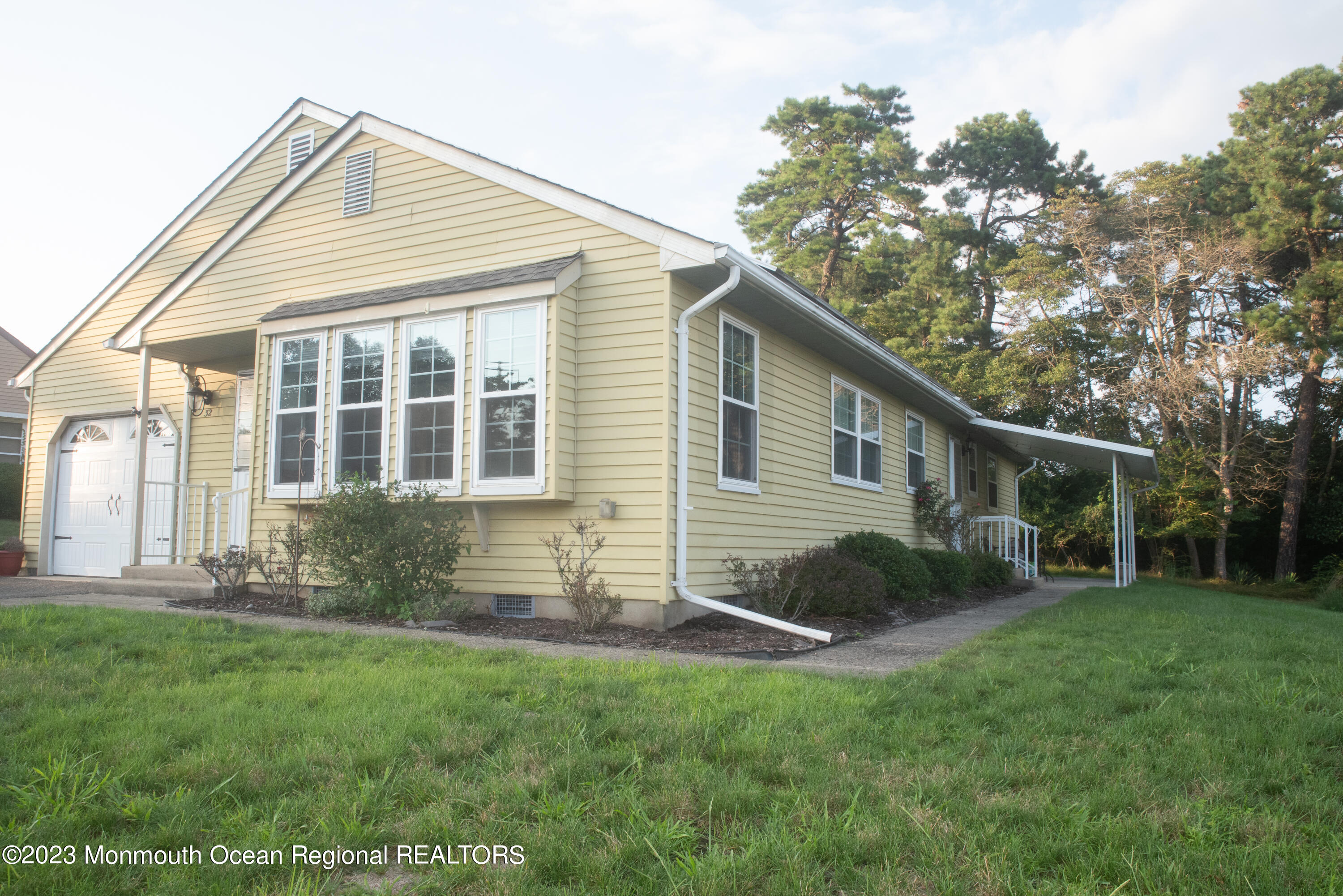 32 Ashley Road Whiting, NJ 08759 - Photo 3 of 23 a view of a house with backyard and sitting area