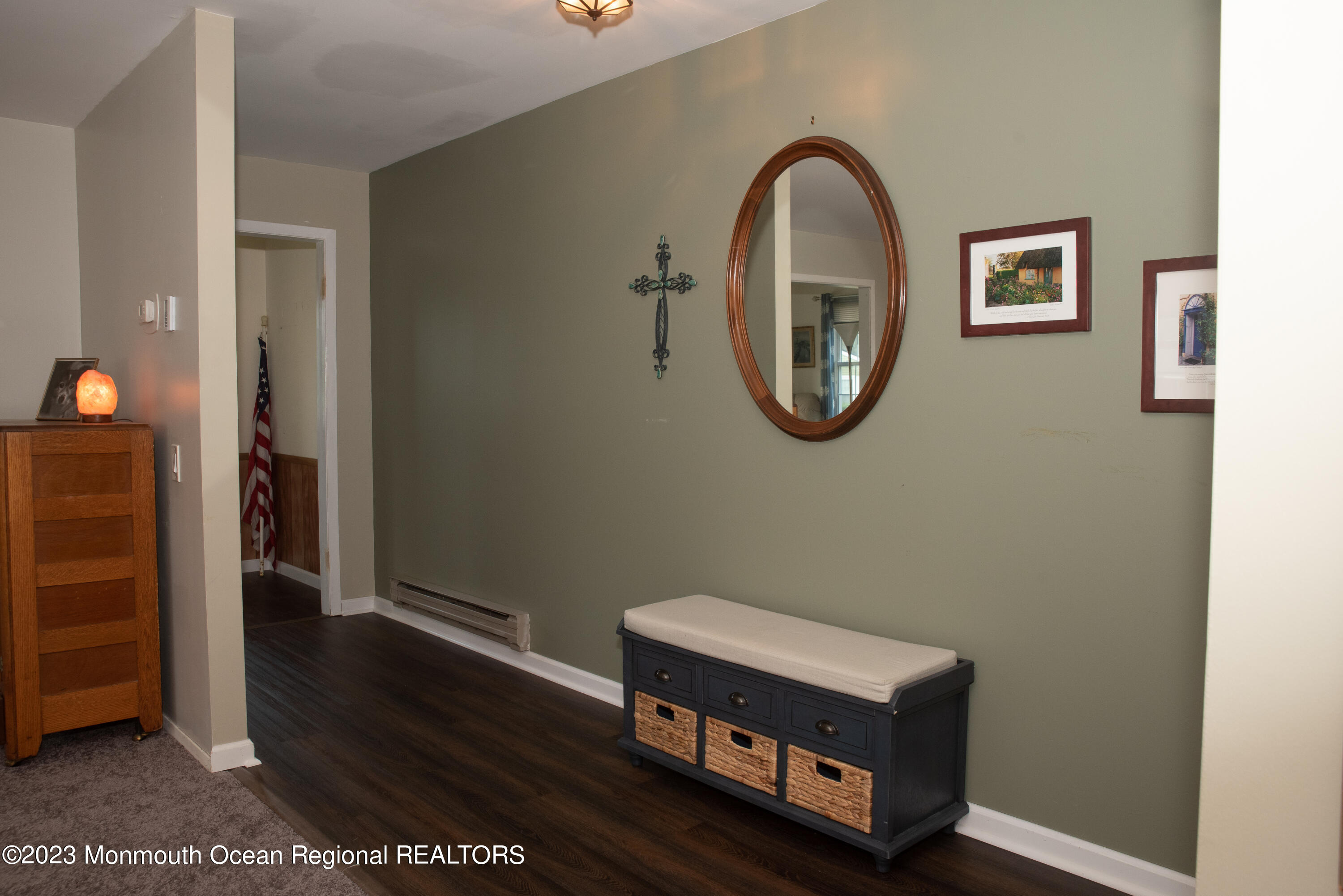 32 Ashley Road Whiting, NJ 08759 - Photo 6 of 23 a room with wooden floor and a mirror