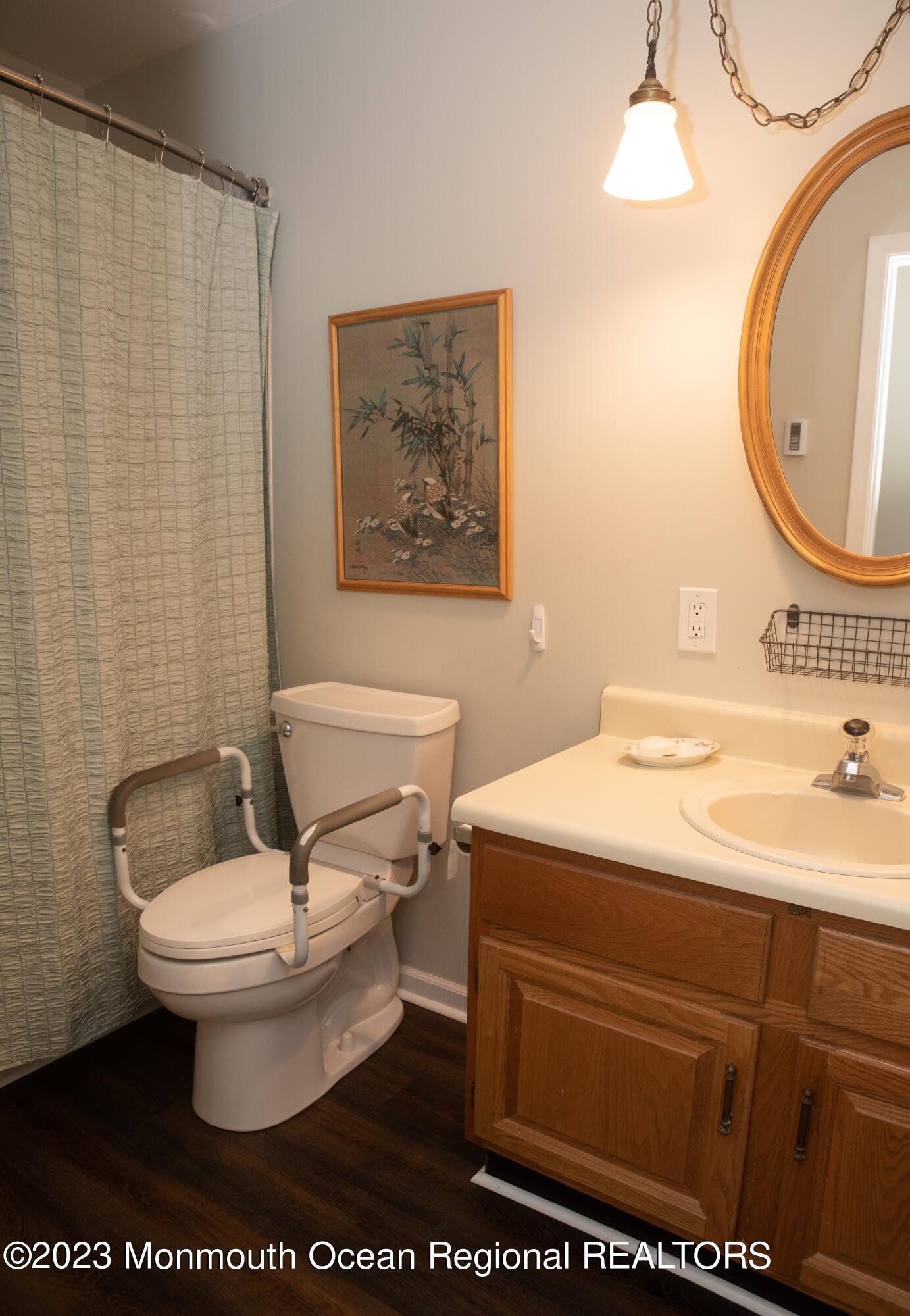 32 Ashley Road Whiting, NJ 08759 - Photo 10 of 23 a bathroom with a toilet sink and mirror