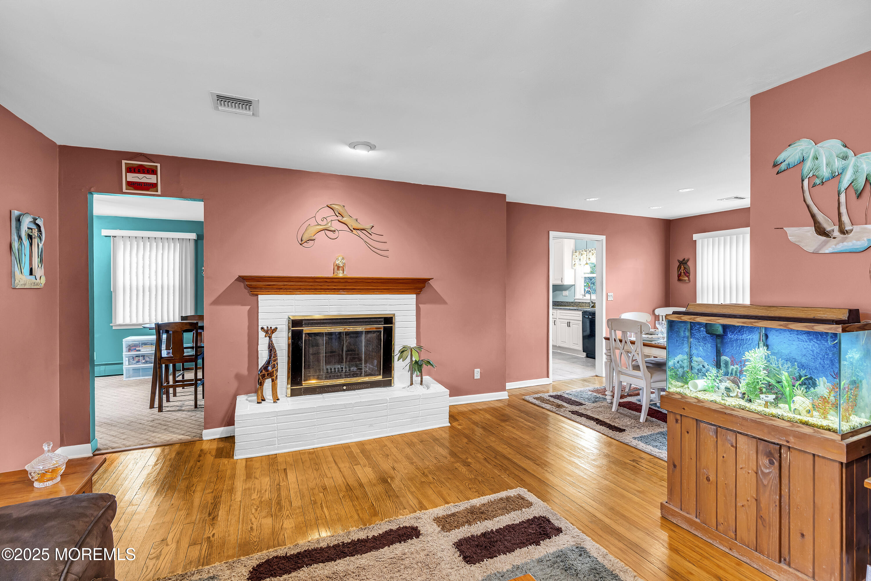 1400 Treeneedle Road Point Pleasant, NJ 08742 - Photo 12 of 45 a living room with furniture and a fireplace