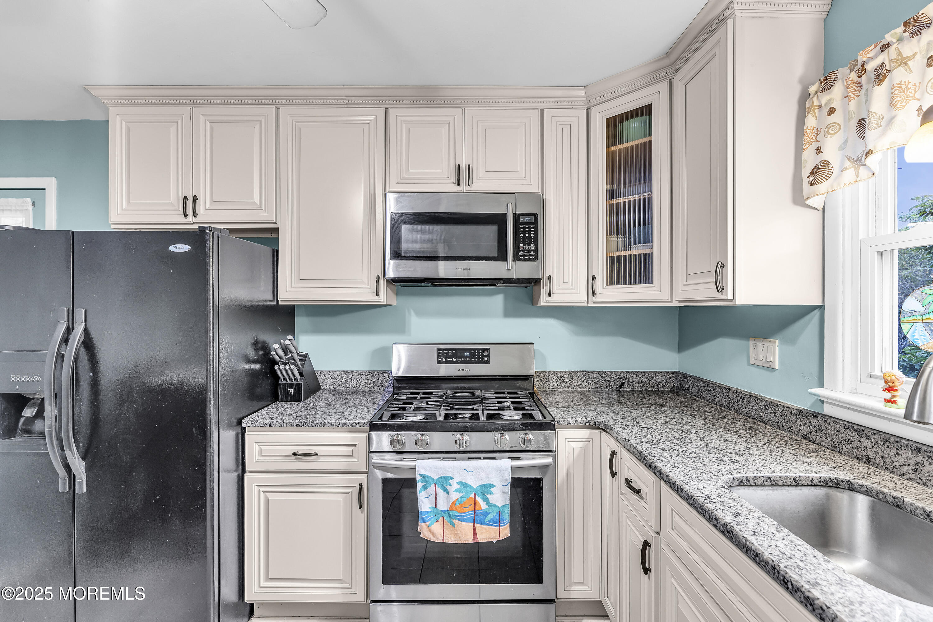 1400 Treeneedle Road Point Pleasant, NJ 08742 - Photo 17 of 45 a kitchen with stainless steel appliances granite countertop a stove a refrigerator and a microwave
