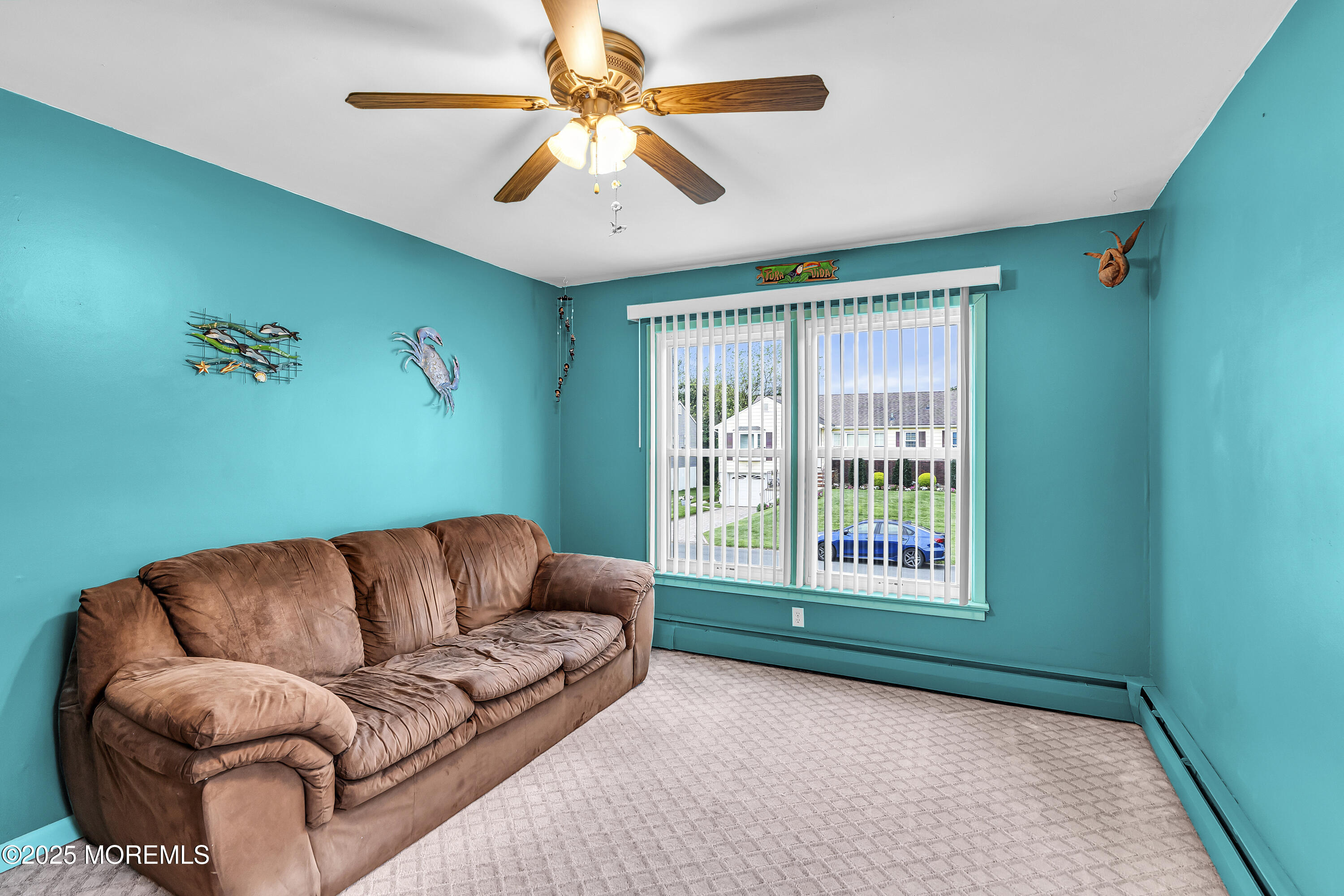 1400 Treeneedle Road Point Pleasant, NJ 08742 - Photo 23 of 45 a living room with furniture and a large window