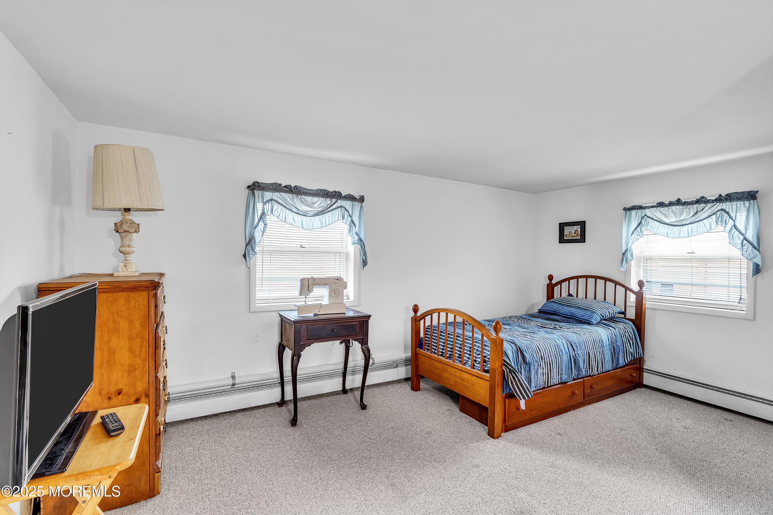 1400 Treeneedle Road Point Pleasant, NJ 08742 - Photo 32 of 45 a bedroom with furniture and a window