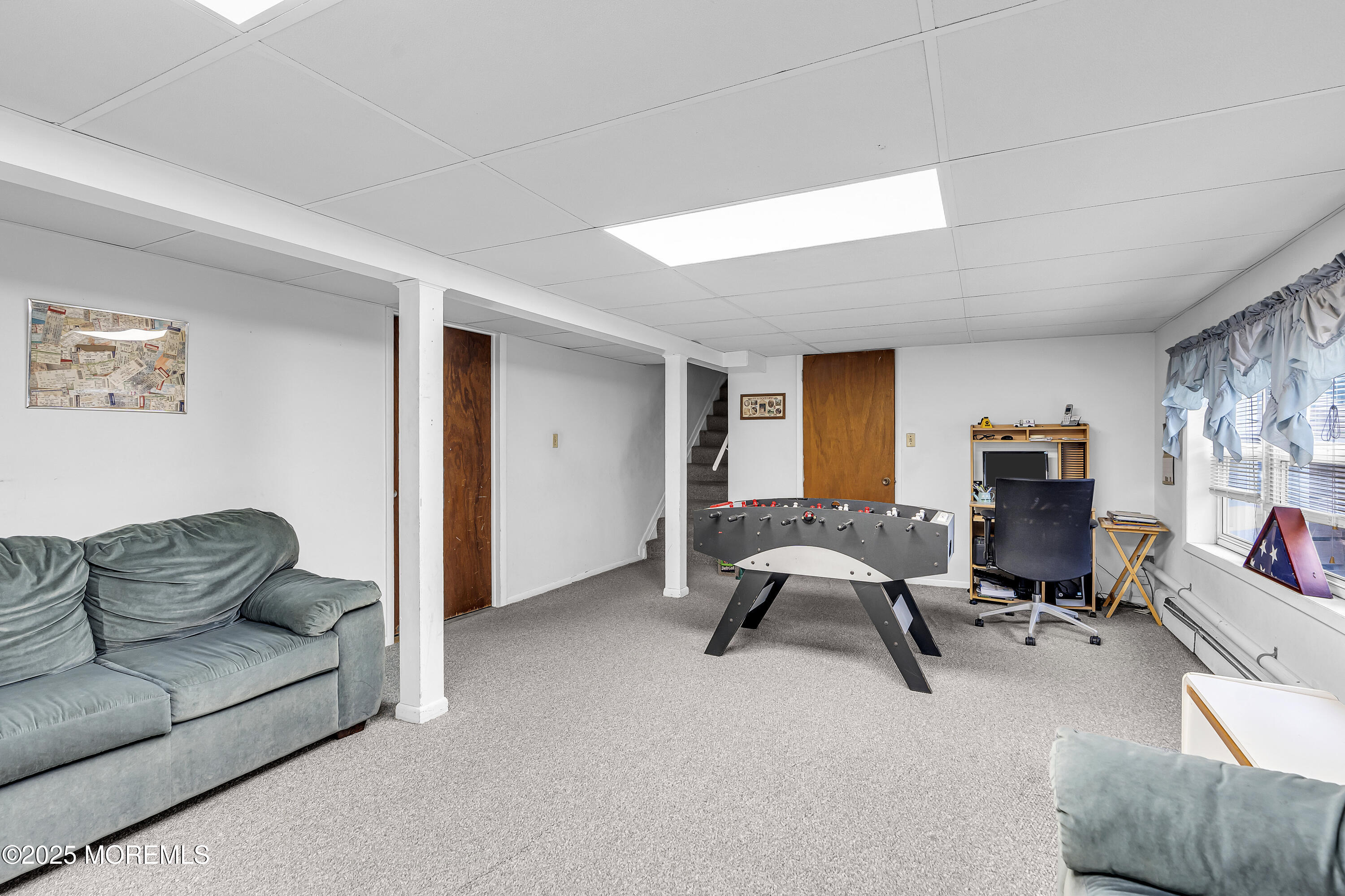 1400 Treeneedle Road Point Pleasant, NJ 08742 - Photo 37 of 45 a workspace with furniture and a couch