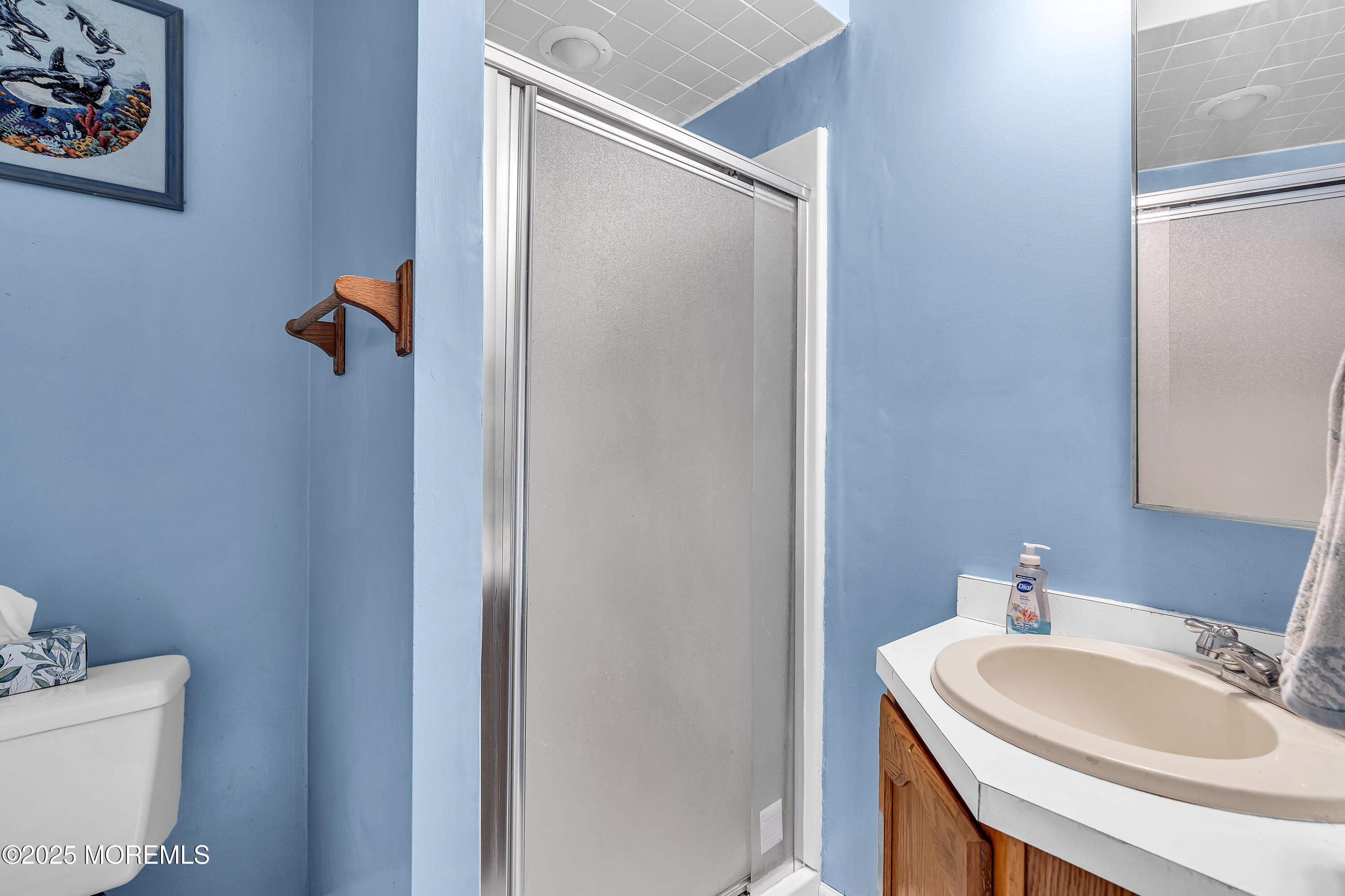 1400 Treeneedle Road Point Pleasant, NJ 08742 - Photo 40 of 45 a bathroom with a sink and a mirror