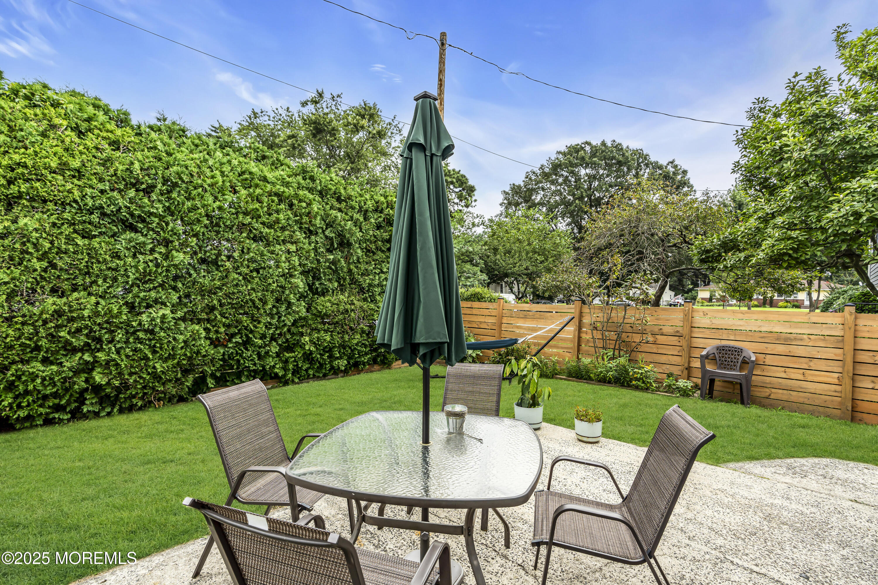 1400 Treeneedle Road Point Pleasant, NJ 08742 - Photo 43 of 45 a view of a chairs and table in the garden