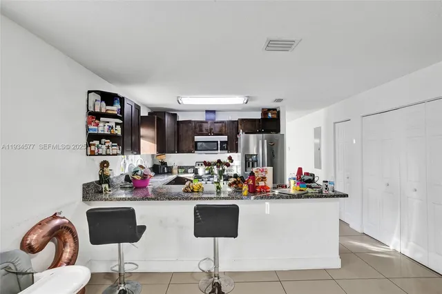 a view of kitchen with dining area