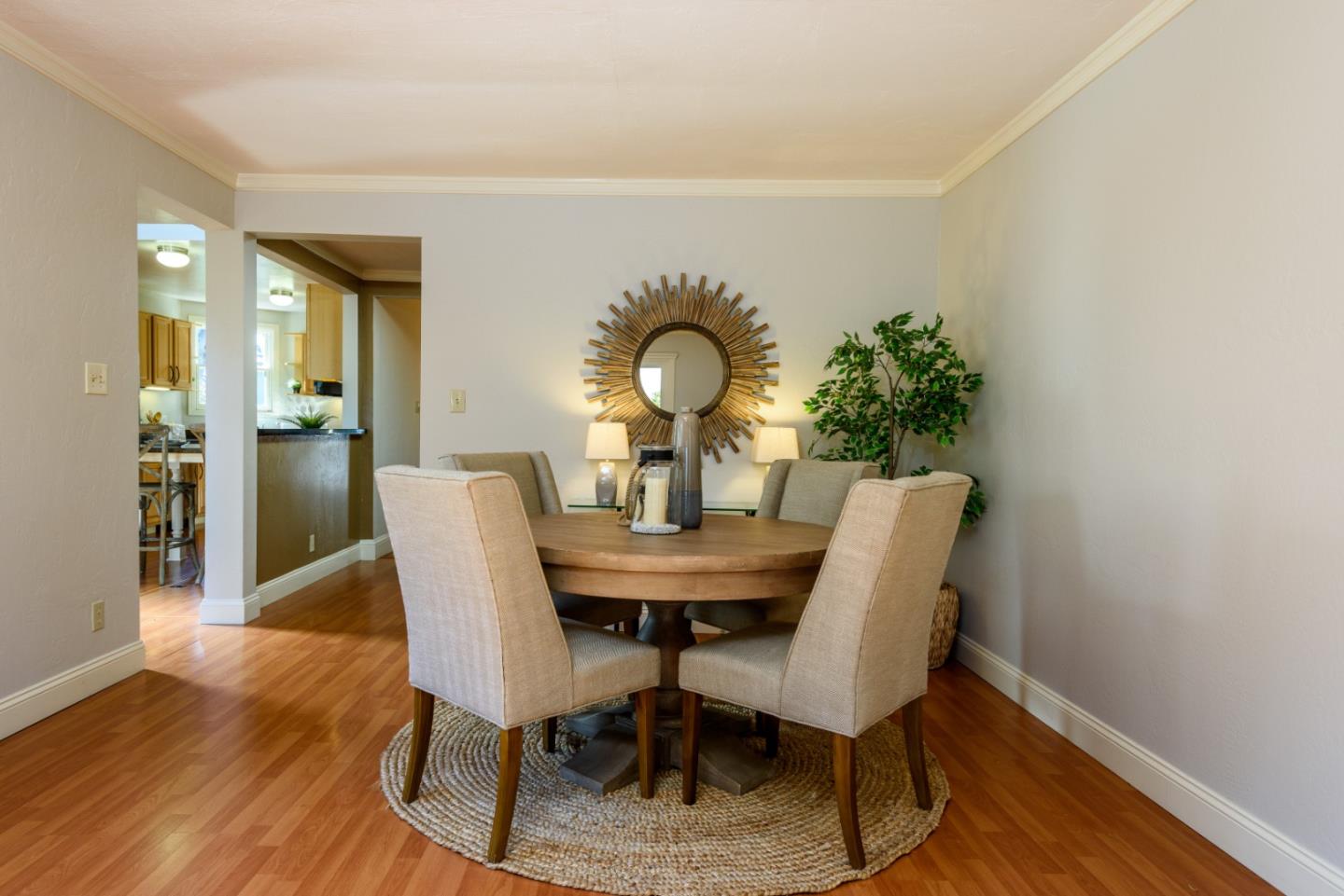 132 Bancroft Road Burlingame, CA 94010 - Photo 14 of 27 a view of a dining room with furniture and wooden floor
