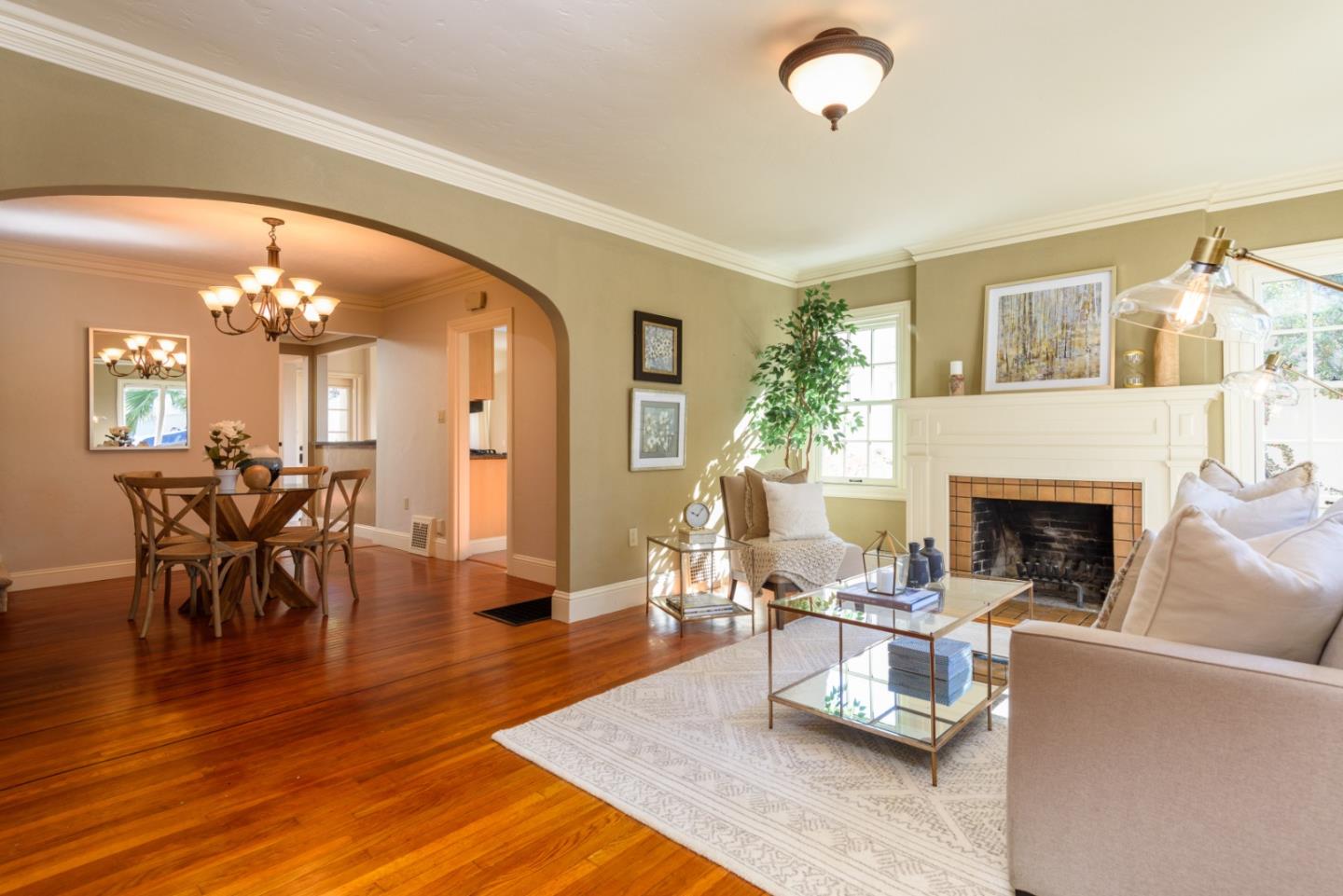 132 Bancroft Road Burlingame, CA 94010 - Photo 2 of 27 a living room with furniture and a chandelier