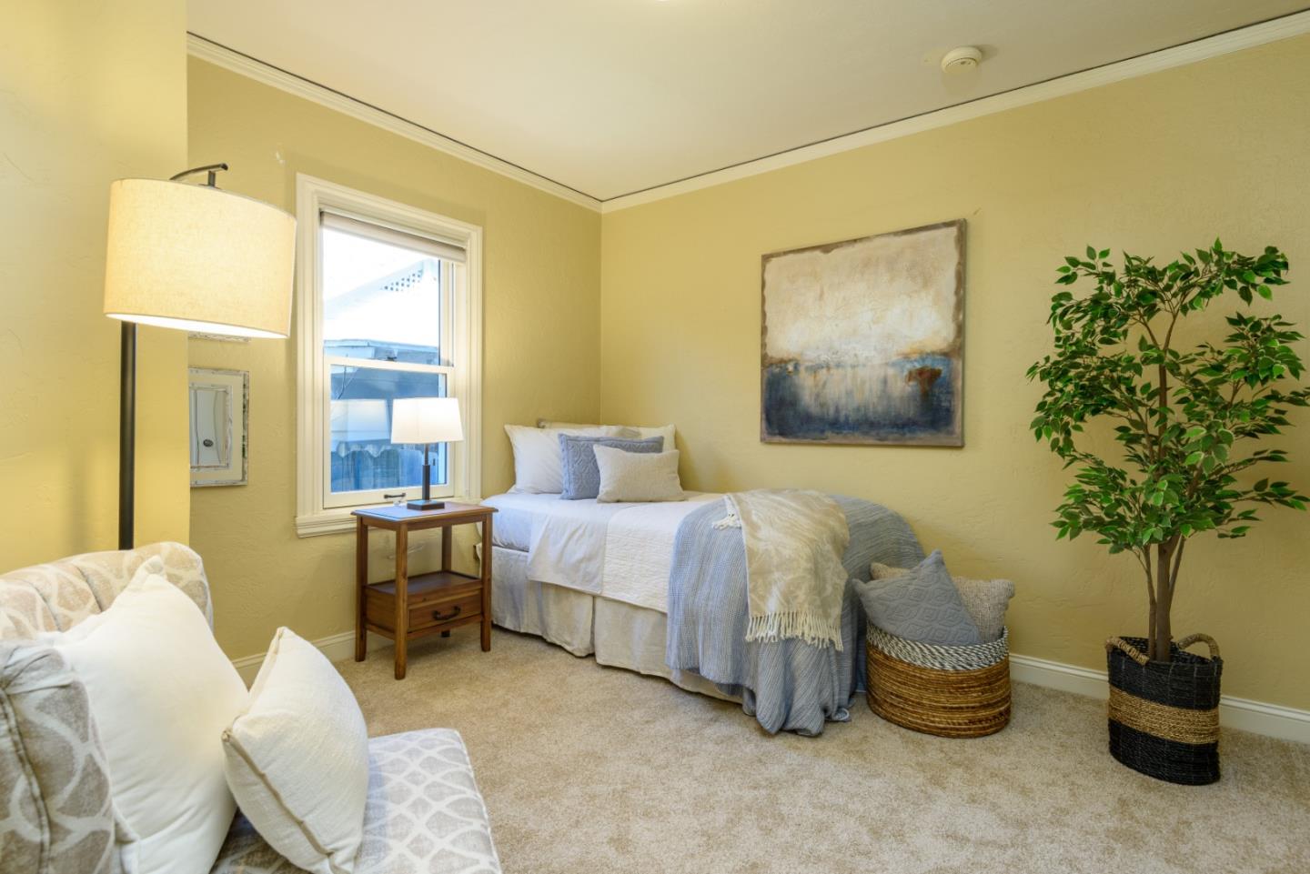 132 Bancroft Road Burlingame, CA 94010 - Photo 21 of 27 a bedroom with a bed and a potted plant